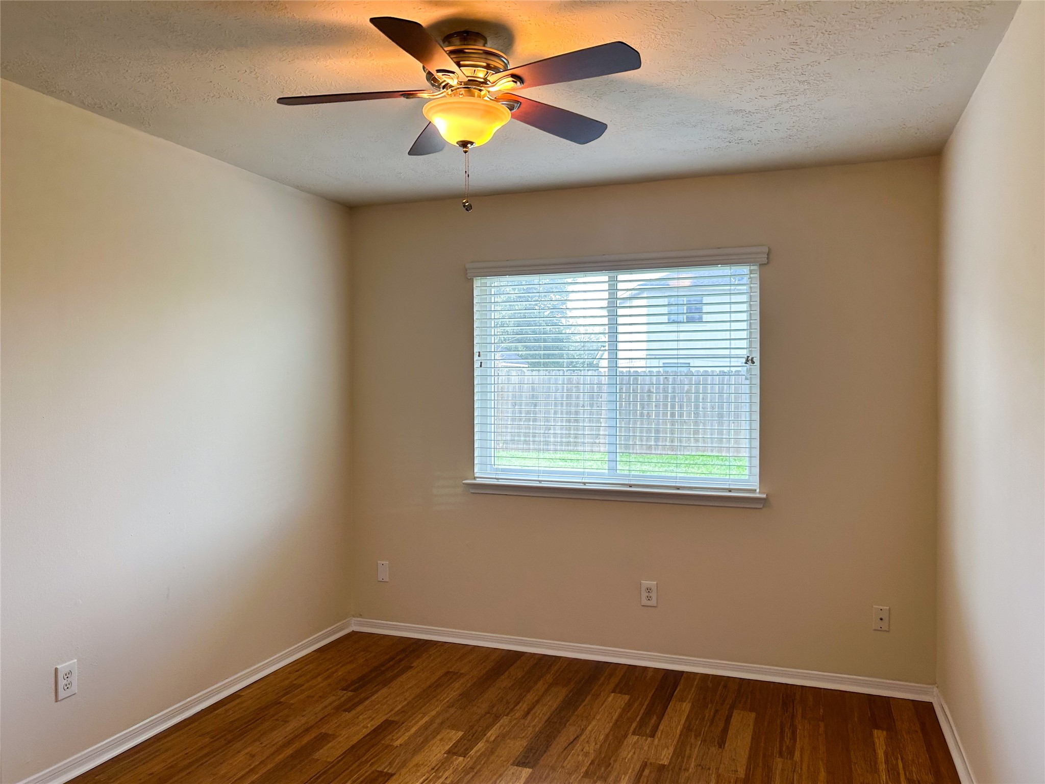 29219 Waltham Street Spring, TX 77386 - Photo 18 of 23 an empty room with a window and a fan