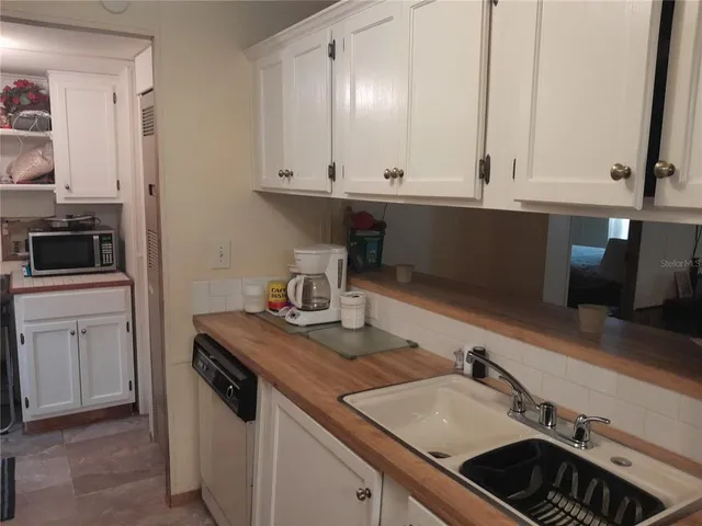 a view of a sink and dishwasher in a kitchen