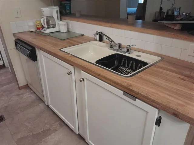 a kitchen with a stove and a refrigerator