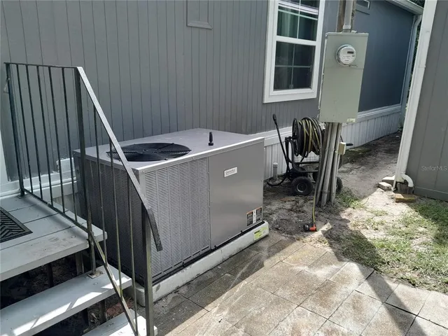 a view of a patio with table and chairs