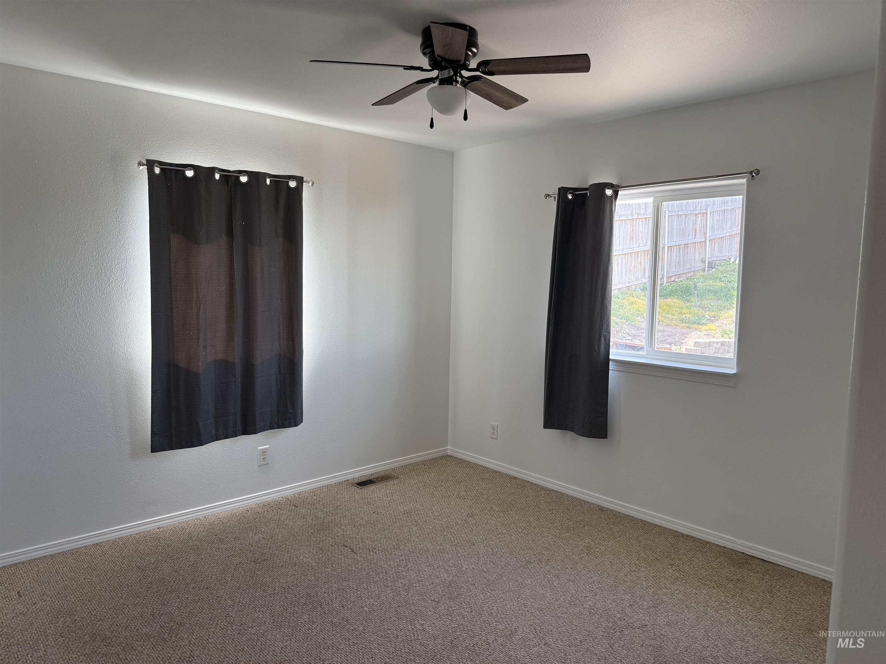 523 Morning Dove Way Marsing, ID 83639 - Photo 14 of 23 Carpeted empty room with a ceiling fan and baseboards