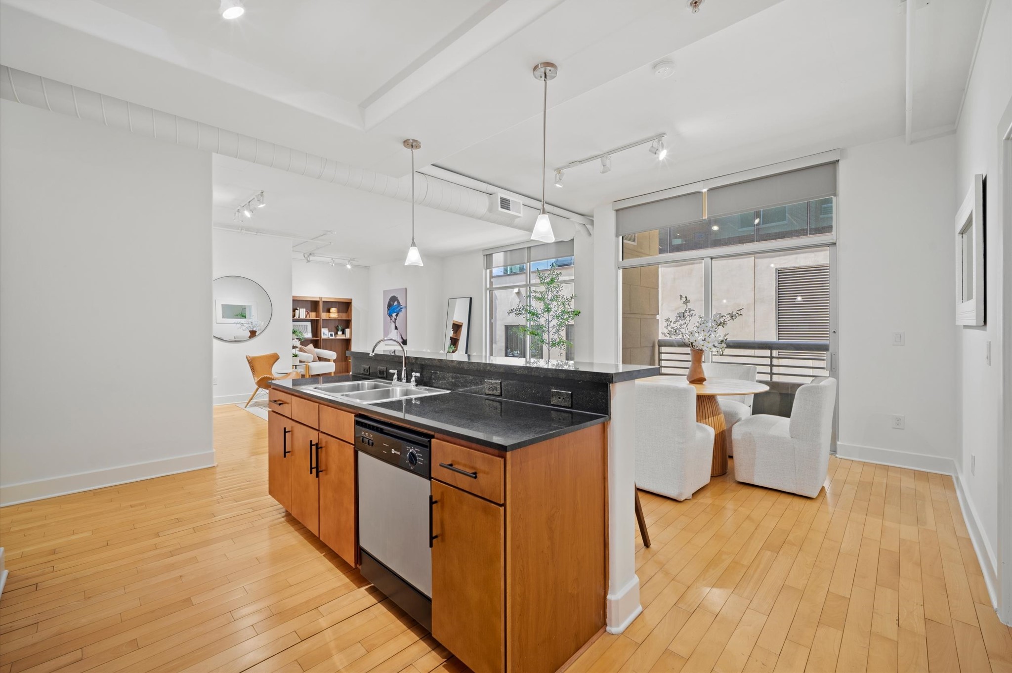 1901 Post Oak Boulevard, Unit 204 Houston, TX 77056 - Photo 23 of 36 Open to the dining and living areas, it anchors the home with clean lines, warm cabinetry, generous counter space, and an easy flow for everyday living or entertaining.