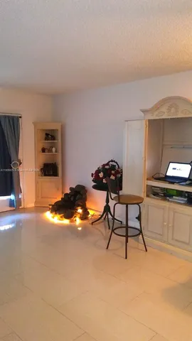 a workspace with furniture and window