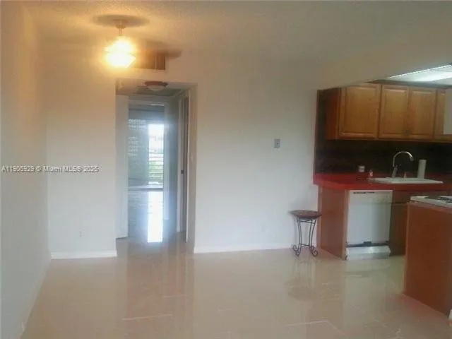 a view of kitchen and utility room