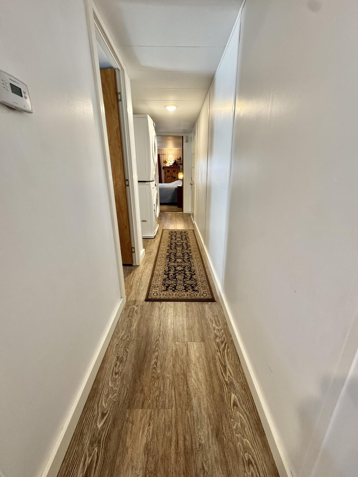 189 Pine View Terrace West Wareham, MA 02571 - Photo 11 of 22 a view of a hallway with wooden floor