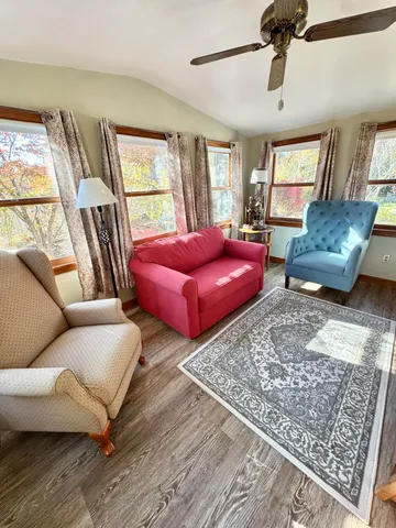 a living room with furniture and a rug