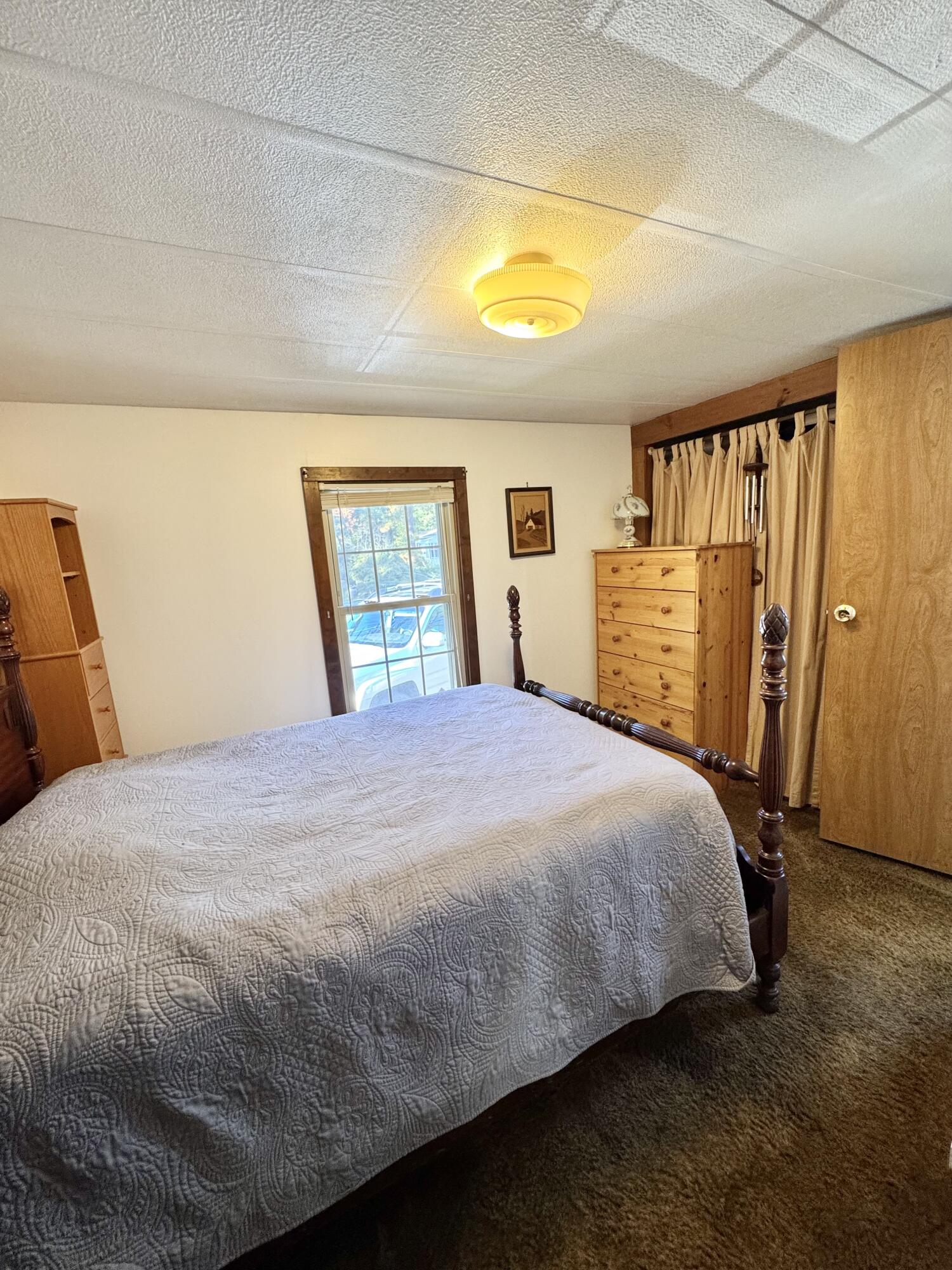 189 Pine View Terrace West Wareham, MA 02571 - Photo 19 of 22 a bed sitting in a bedroom next to a window