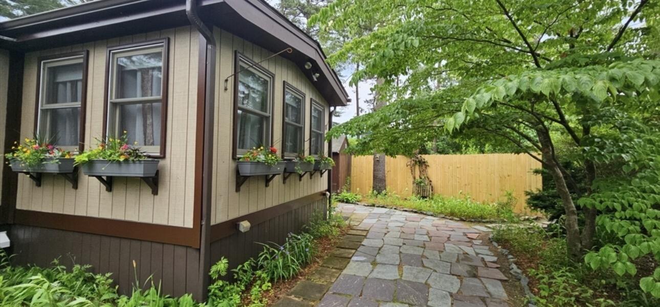 189 Pine View Terrace West Wareham, MA 02571 - Photo 21 of 22 a view of a house with a small yard plants and large tree