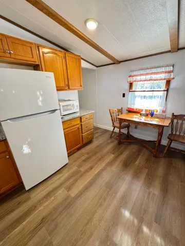 a room with wooden floor and furniture