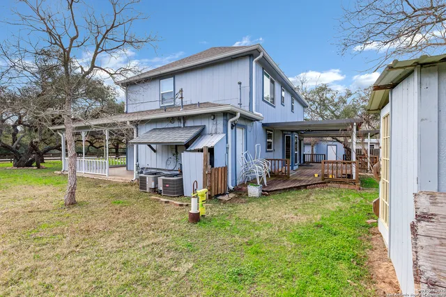a view of a house with a yard porch and sitting area