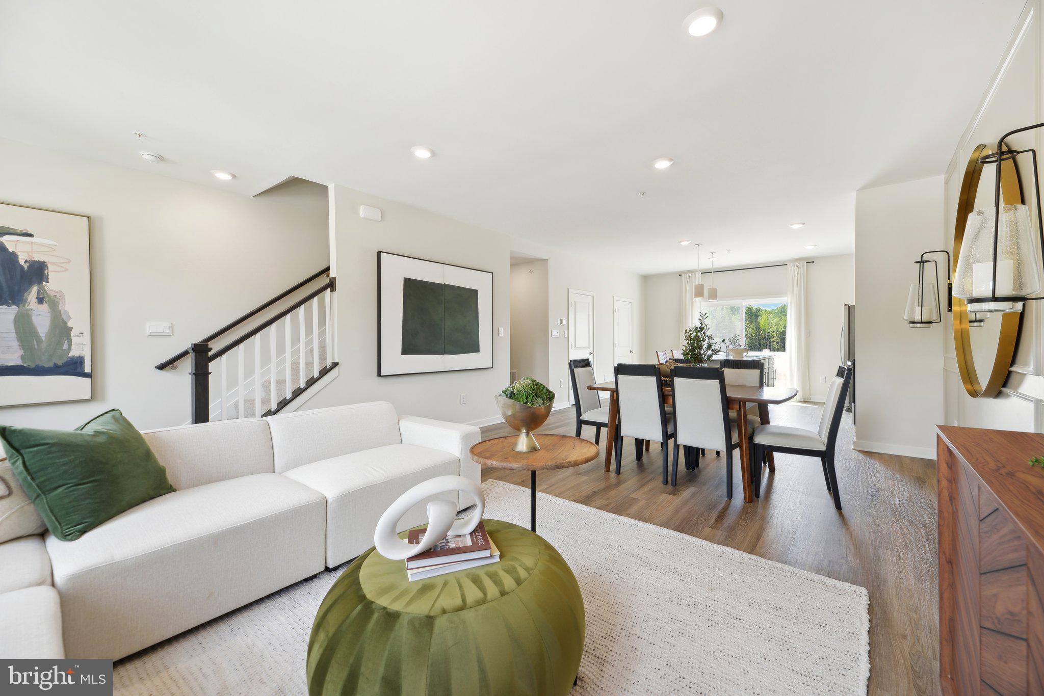 466 Still Feather Avenue La Plata, MD 20646 - Photo 20 of 89 a living room with furniture wooden floor and a table