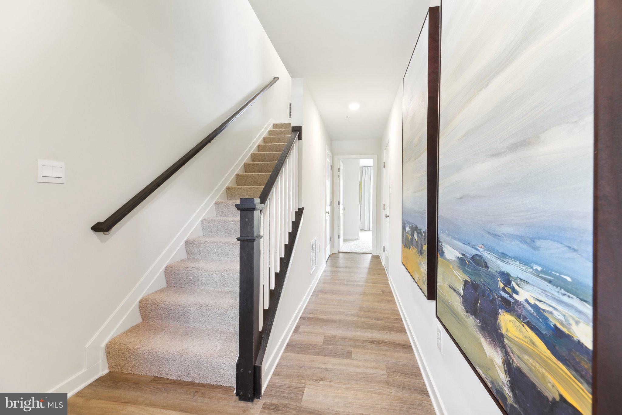 466 Still Feather Avenue La Plata, MD 20646 - Photo 28 of 89 a view of a hallway with wooden floor and staircase