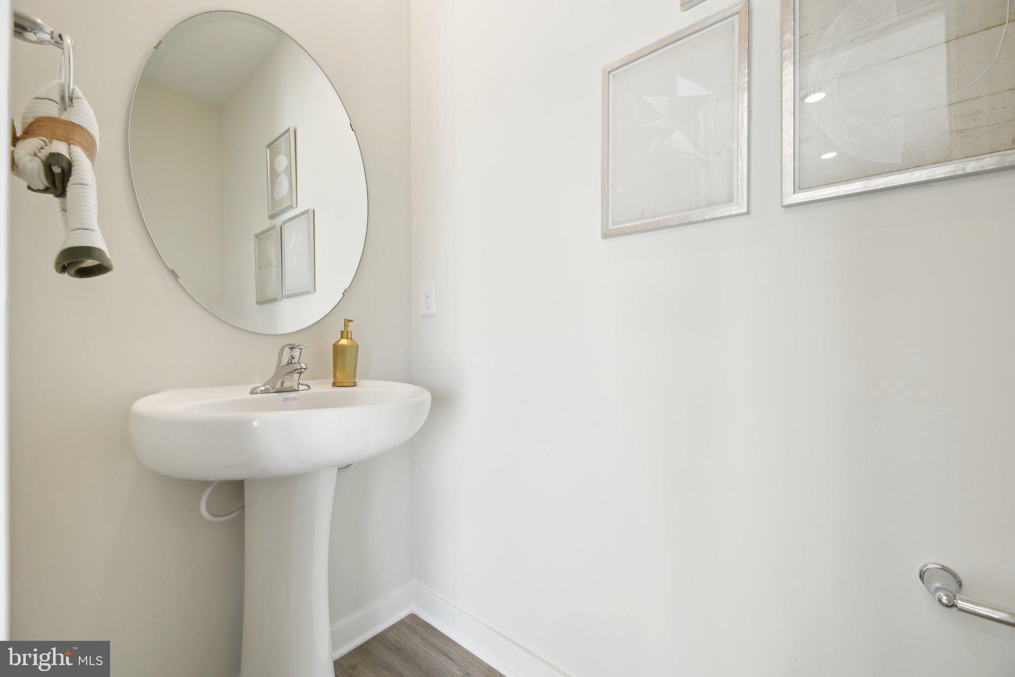 466 Still Feather Avenue La Plata, MD 20646 - Photo 32 of 89 a bathroom with a sink a mirror and shower