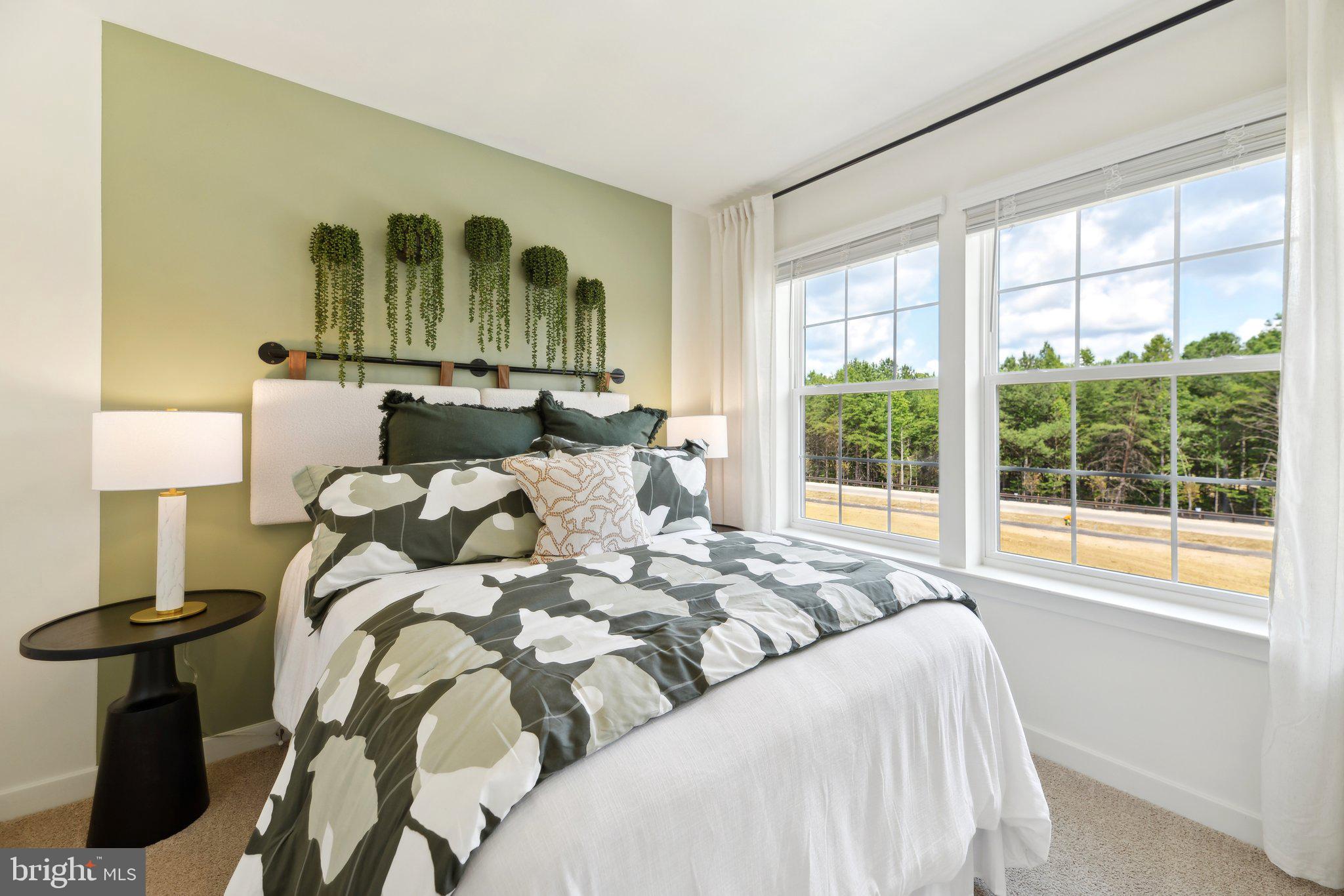 466 Still Feather Avenue La Plata, MD 20646 - Photo 34 of 89 a bed sitting in a bedroom next to a window