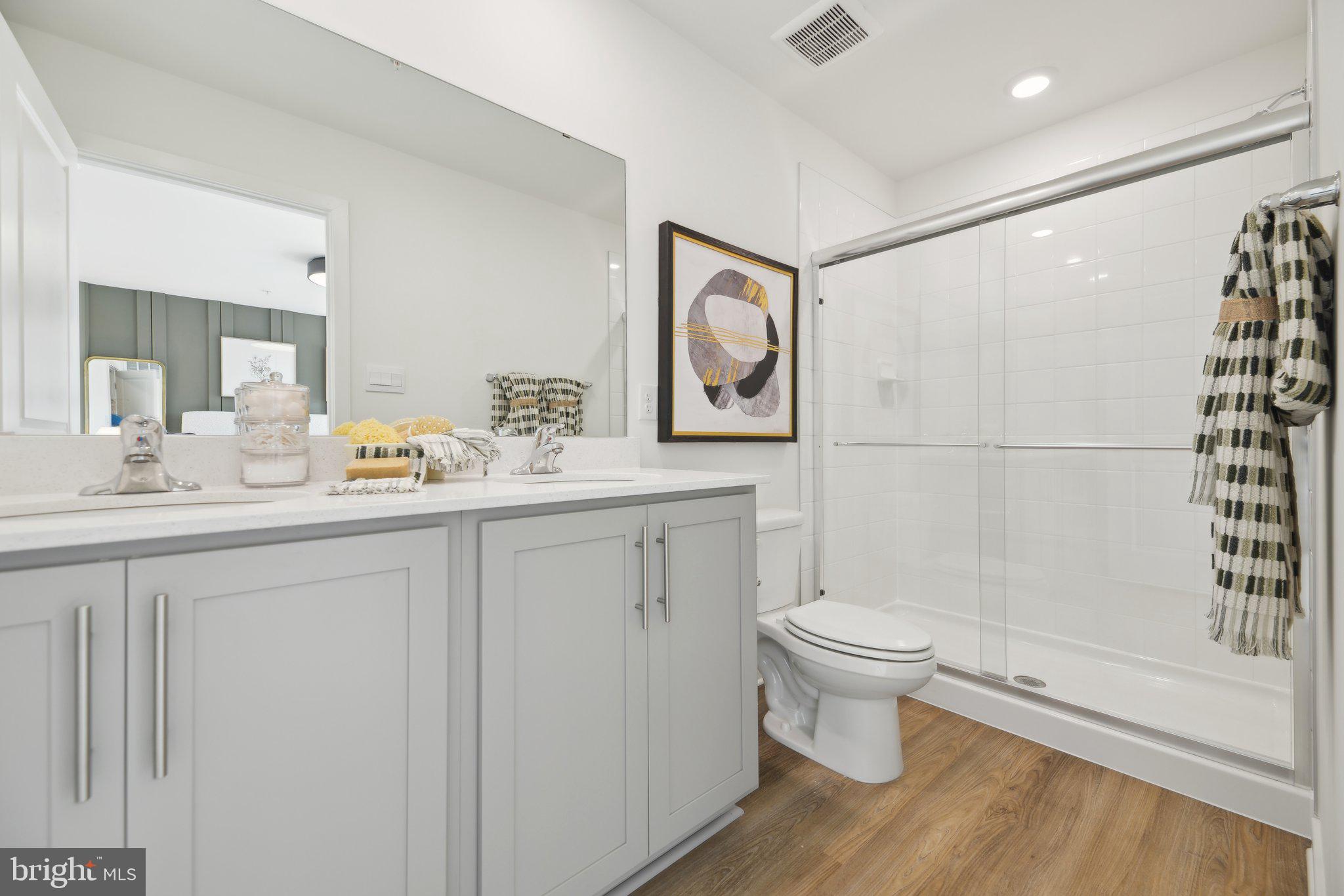 466 Still Feather Avenue La Plata, MD 20646 - Photo 43 of 89 a bathroom with a sink toilet and shower