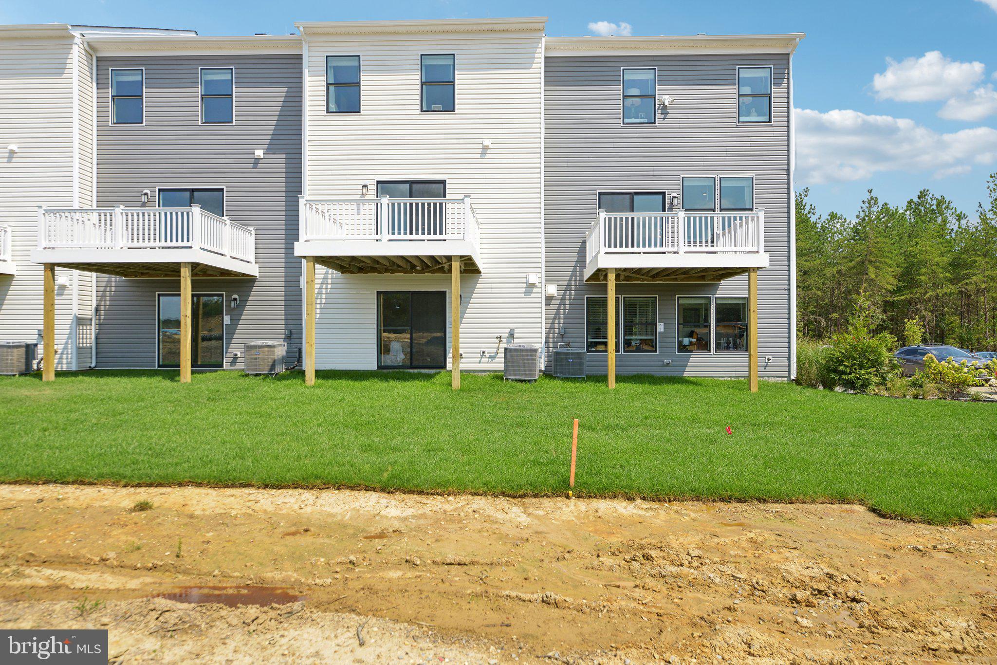 466 Still Feather Avenue La Plata, MD 20646 - Photo 57 of 89 a front view of a house with a garden and yard