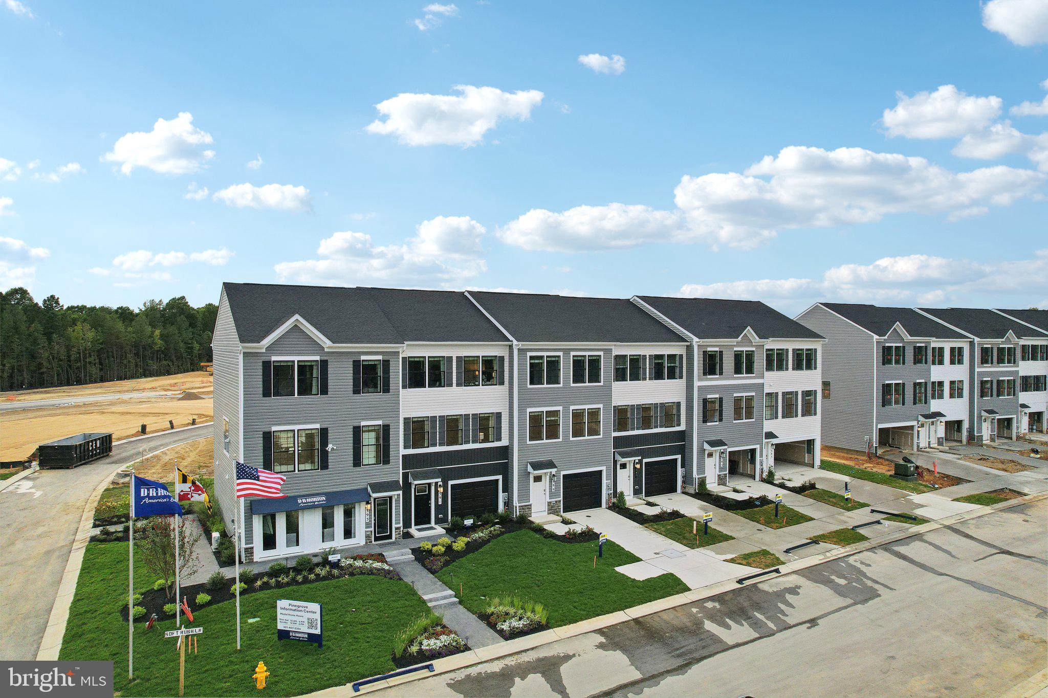 466 Still Feather Avenue La Plata, MD 20646 - Photo 61 of 89 a front view of a residential apartment building with a yard