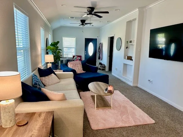 a living room with furniture and a flat screen tv
