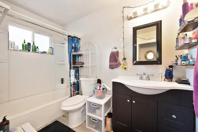 a living room with furniture and a rug