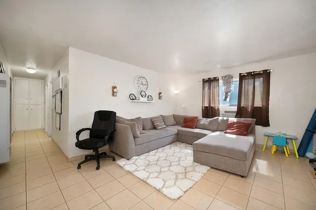 a kitchen with stainless steel appliances granite countertop a stove and a refrigerator