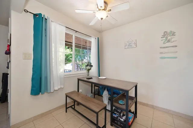 a bedroom with a large bed and a flat screen tv