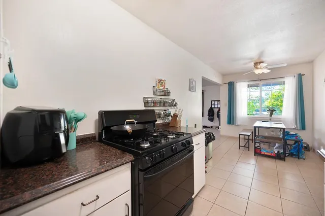 a kitchen with stainless steel appliances granite countertop a stove and a sink