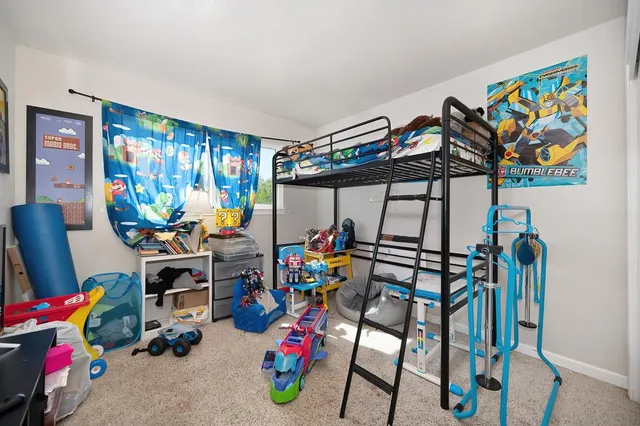 a living room with furniture flat screen tv and a fireplace