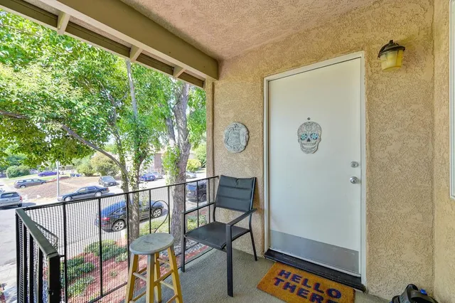 a kitchen with stainless steel appliances granite countertop a sink and a refrigerator