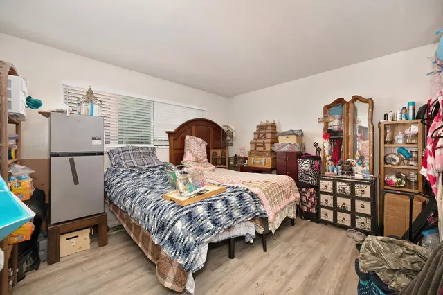 a kitchen with stainless steel appliances granite countertop a stove and a dining table view