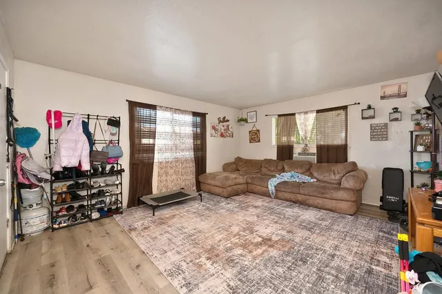 a view of a backyard with tree