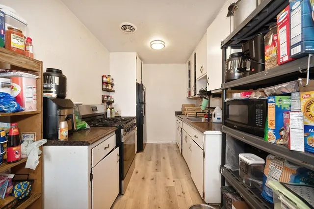 an aerial view of house with yard and outdoor seating