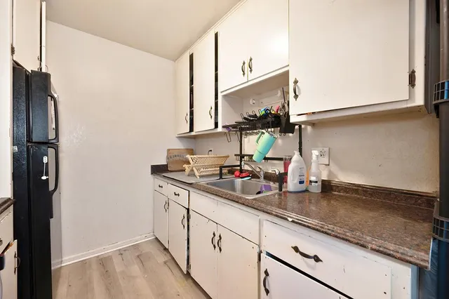 an aerial view of house with yard and seating space