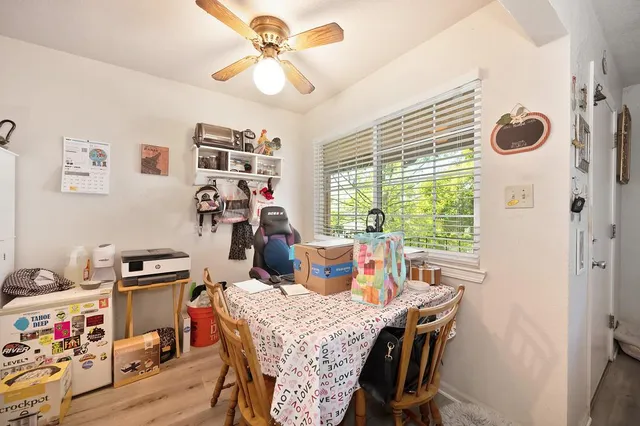 a bedroom with furniture and a flat screen tv