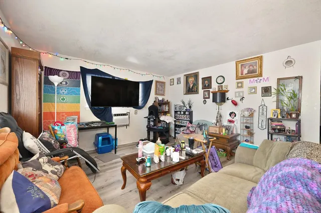 a living room with furniture and a table