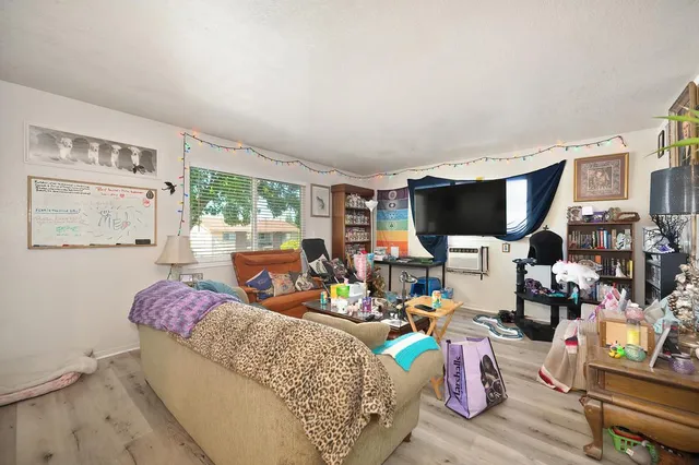 a view of a workspace with furniture and toys