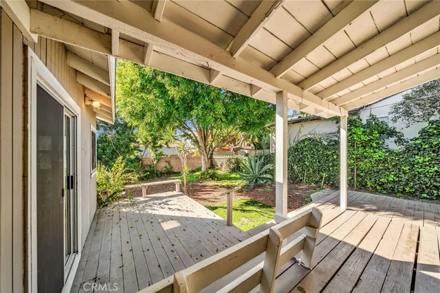 a view of backyard with swimming pool