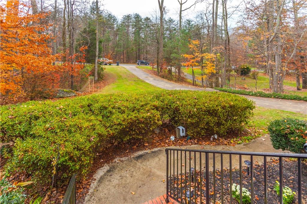6599 Currieton Drive Oak Ridge, NC 27310 - Photo 2 of 30 A glance from the front allows you to soak in the privacy and views!