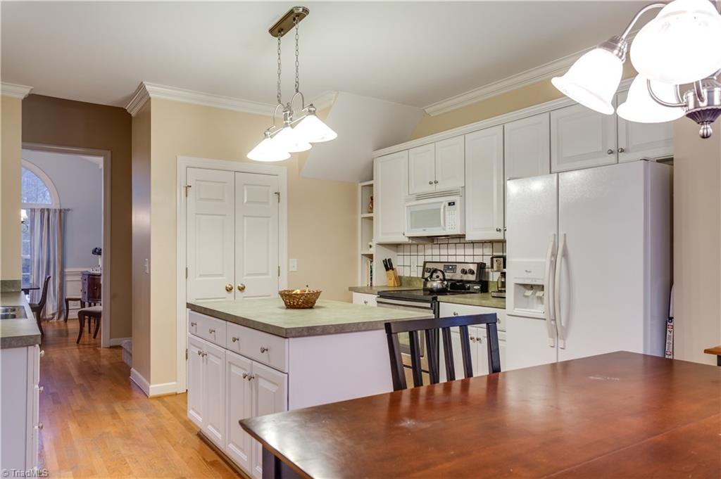6599 Currieton Drive Oak Ridge, NC 27310 - Photo 10 of 30 The kitchen also features an oversized pantry for all of your additional storage needs.