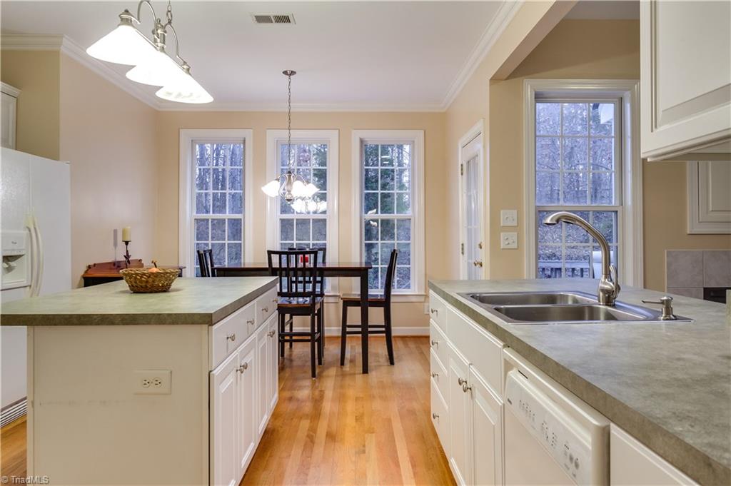 6599 Currieton Drive Oak Ridge, NC 27310 - Photo 11 of 30 The kitchen is open to the recessed breakfast area, a perfect place to enjoy your morning coffee!