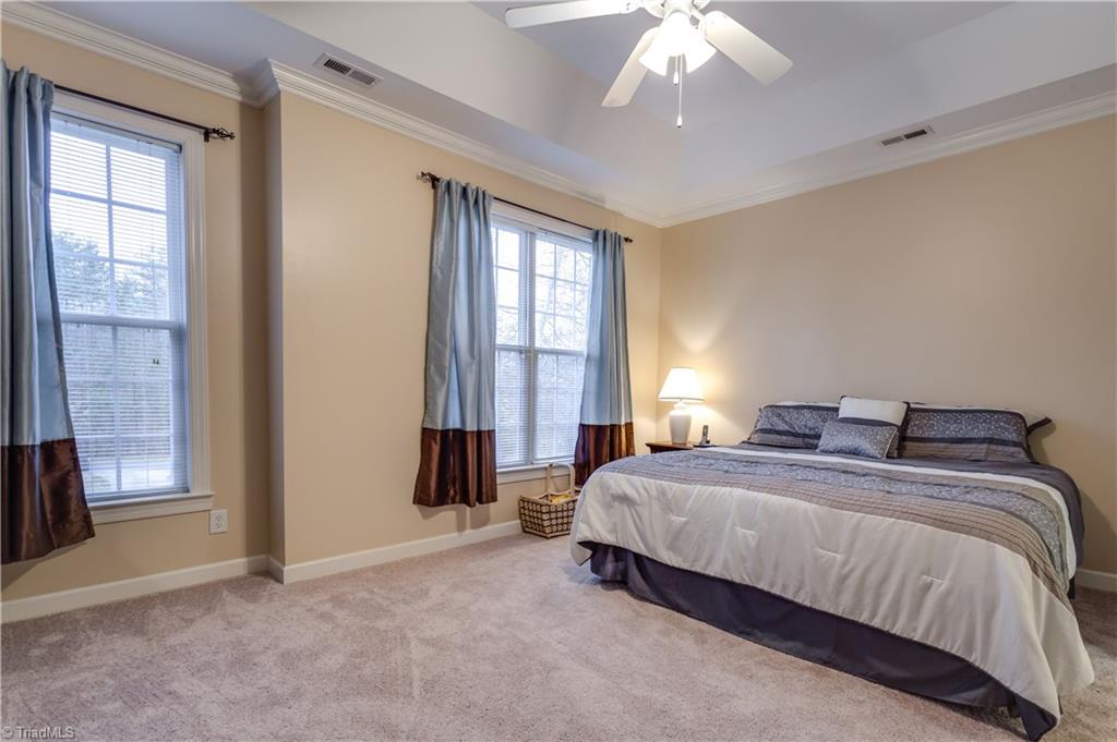 6599 Currieton Drive Oak Ridge, NC 27310 - Photo 12 of 30 The Master Suite features a Trey ceiling, custom moldings, brand new carpet and neutral paint, as well as an En Suite Bath!