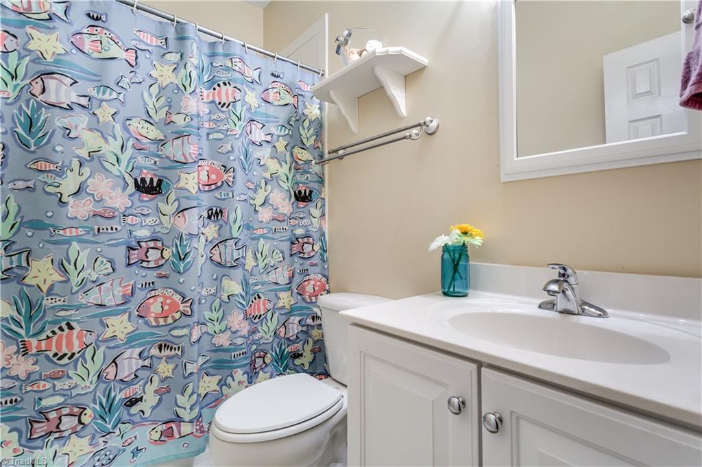 6599 Currieton Drive Oak Ridge, NC 27310 - Photo 16 of 30 The main level 2'nd and 3'rd bedroom share one bathroom!