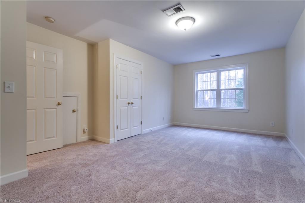 6599 Currieton Drive Oak Ridge, NC 27310 - Photo 17 of 30 The upstairs Bonus room is oversized, perfect for a kids playroom or home office or could be used as an additional bedroom.