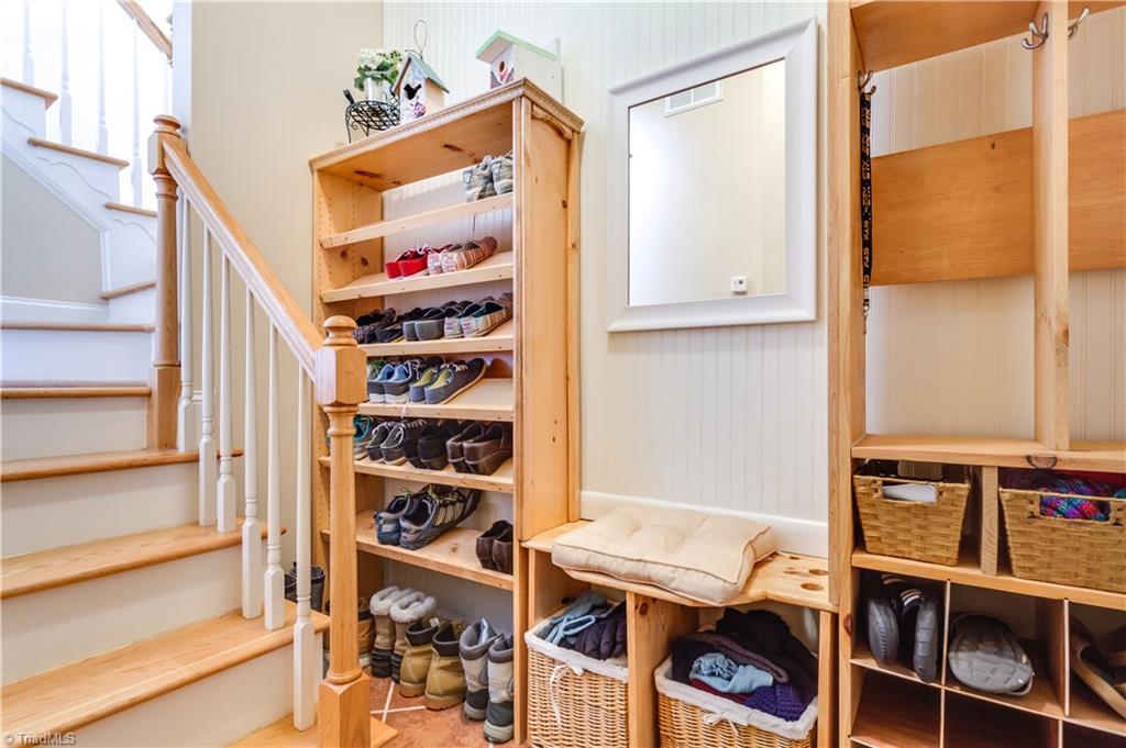 6599 Currieton Drive Oak Ridge, NC 27310 - Photo 23 of 30 Upon entering from the garage, the entry has custom built ins, perfect for your families shoes, bookbags, coats, etc.