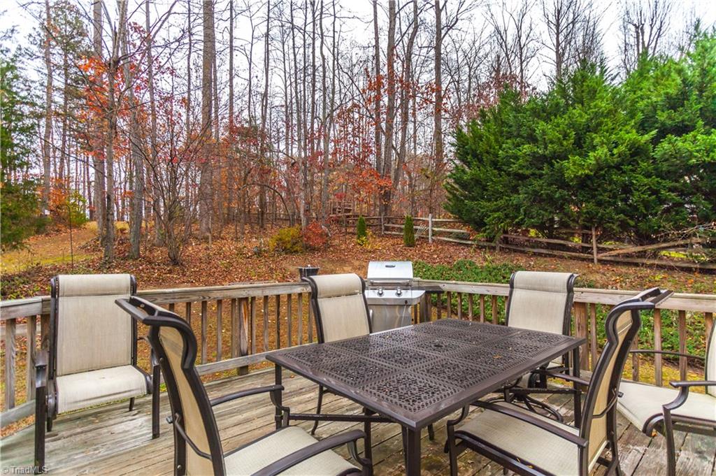 6599 Currieton Drive Oak Ridge, NC 27310 - Photo 24 of 30 The rear deck is perfect for family BBQ's!