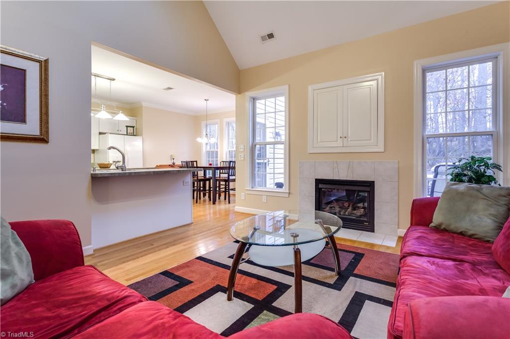 6599 Currieton Drive Oak Ridge, NC 27310 - Photo 7 of 30 The Great room is open to the kitchen, perfect for the involved chef in your family!