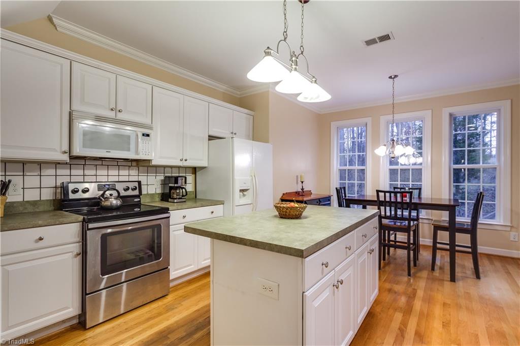 6599 Currieton Drive Oak Ridge, NC 27310 - Photo 9 of 30 The center island offers a perfect food prep location!