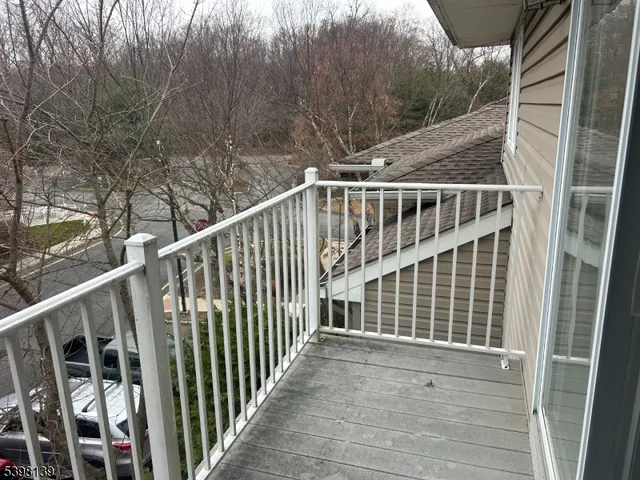 a bathroom with a granite countertop toilet and a sink