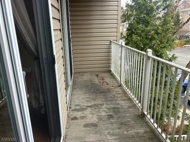 a view of a balcony with a door