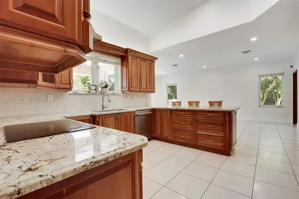a bathroom with a tub shower sink and mirror