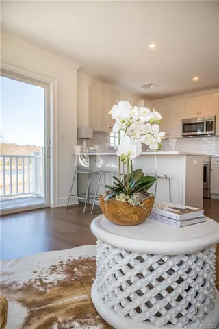 a dining room with furniture and window